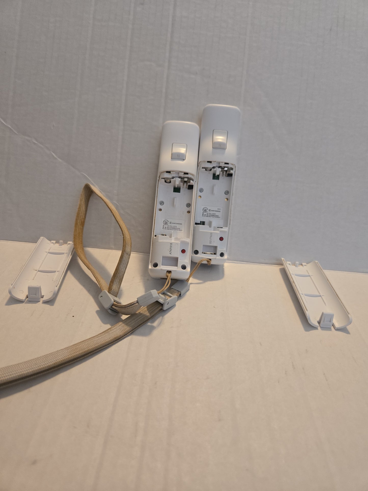 Pair Of Nintendo Wii Remotes With Nunchucks