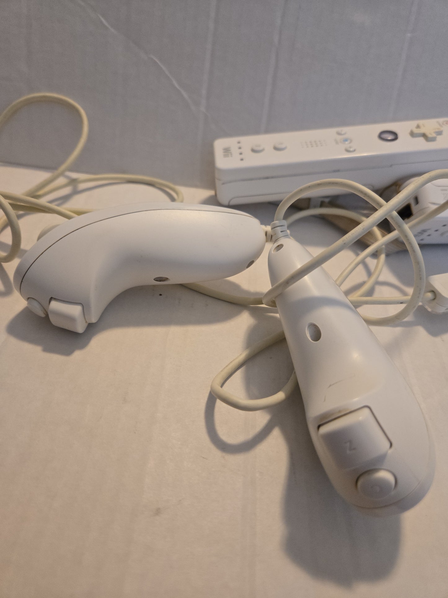 Pair Of Nintendo Wii Remotes With Nunchucks