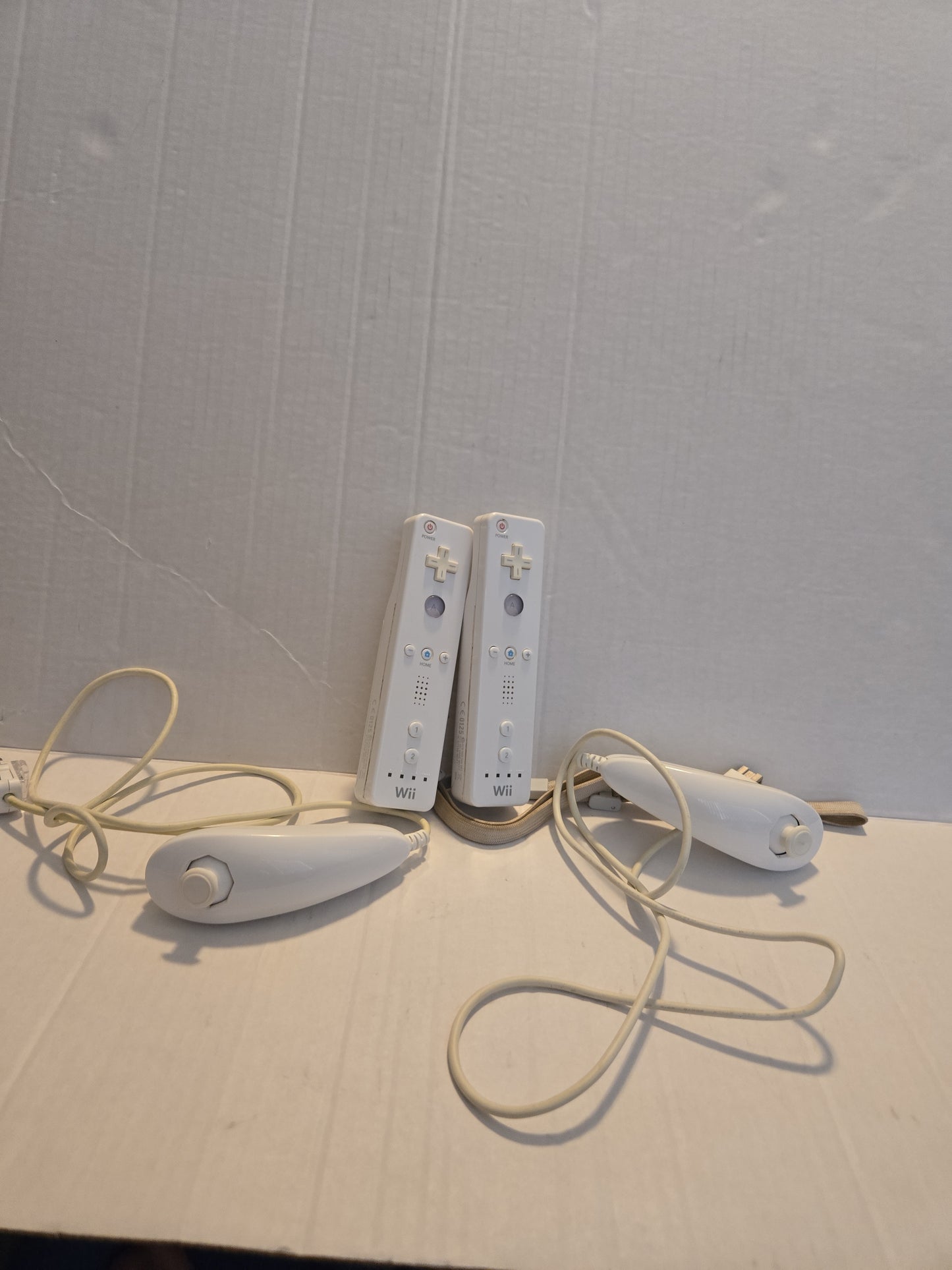 Pair Of Nintendo Wii Remotes With Nunchucks